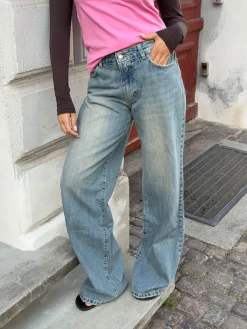 Alaia lavtaljede jeans med lyndetalje - Lys denim