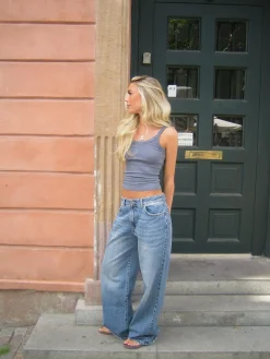Alaia lavtaljede jeans med lyndetalje - Lys denim