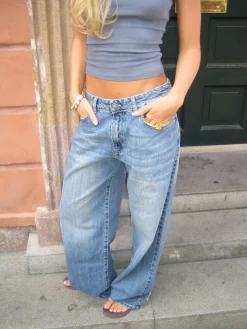 Alaia lavtaljede jeans med lyndetalje - Lys denim