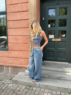 Alaia lavtaljede jeans med lyndetalje - Lys denim